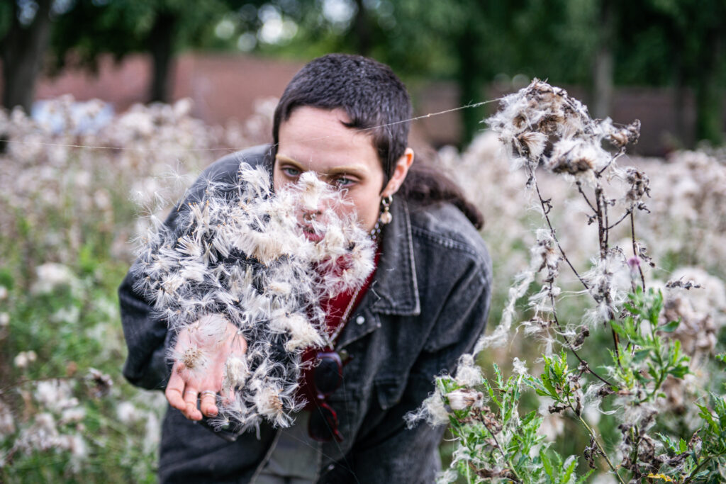 Moss Berke admiring land art made at their workshop
